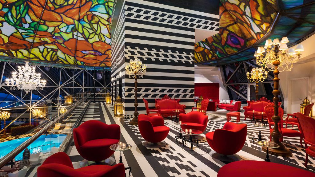 The maximalist interior of the Mondrian Doha Hotel's roof top pool.