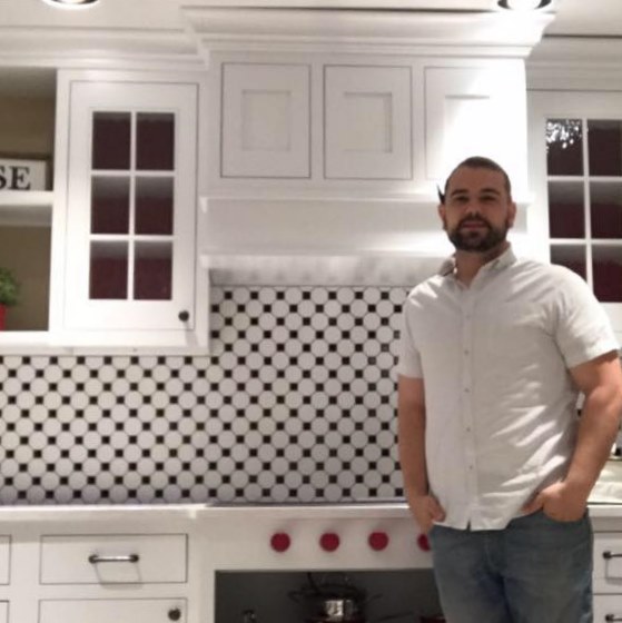 Chief Architect customer, Paul Machado., standing in front of his finished kitchen design